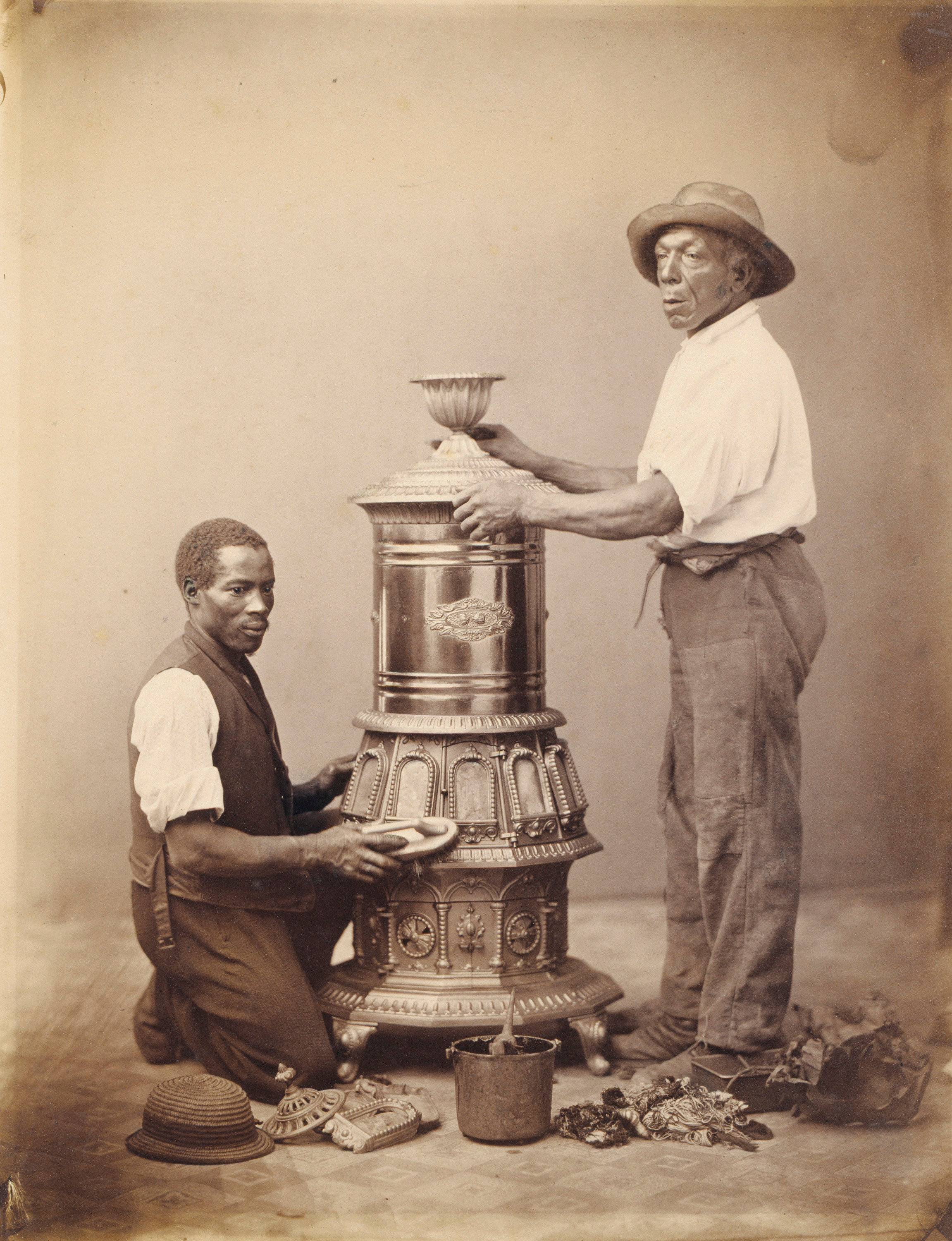 [Two Workmen Polishing a Stove]