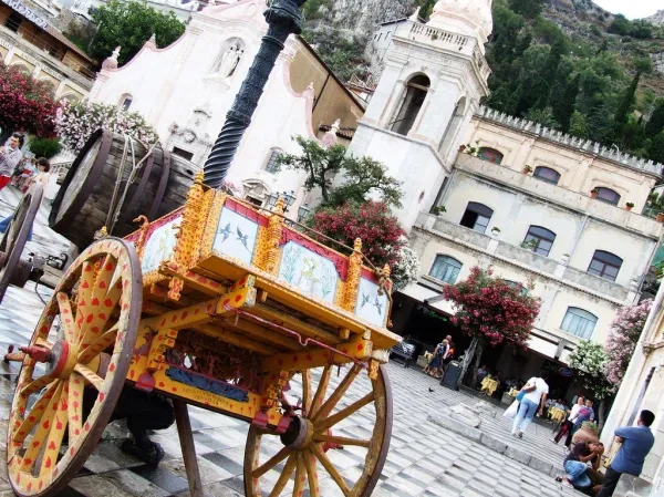 A decorated cart in a Taormina church square